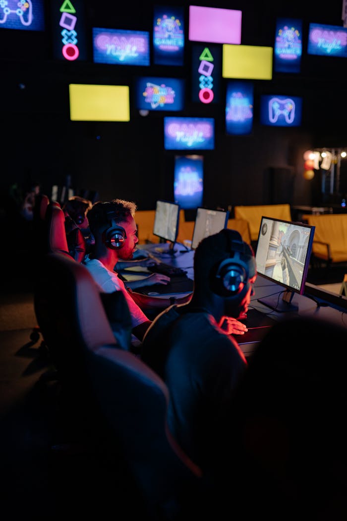 The Art of Drawing Readers In: Your attractive post title goes here Competitive esports event with young adults gaming indoors. Focus on teamwork and technology.